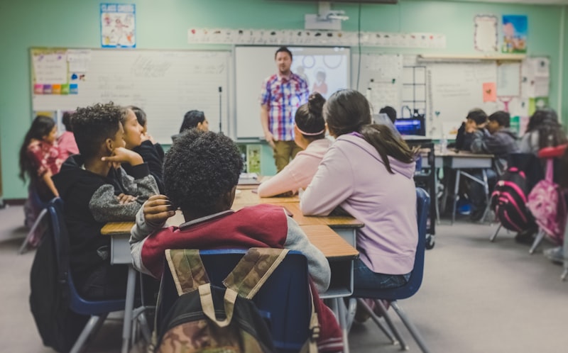 Teacher using sign pdf online free for a school printable pdf on a tablet.